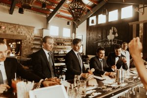 men in suits with cocktails