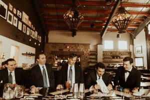 men in suits at bar