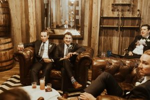 men in suits drinking cocktails