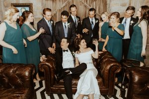 wedding party, bride, and groom drinking cocktails