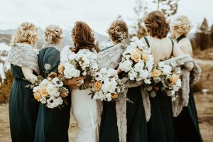 bride and bridesmaids with bouquets