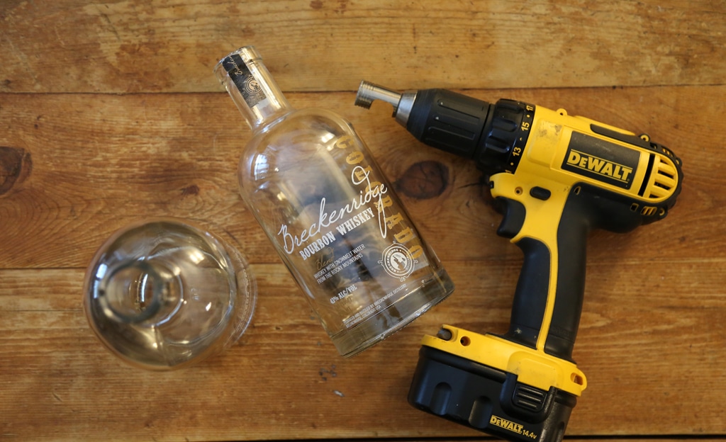 Bourbon whiskey bottle next to DeWalt drill