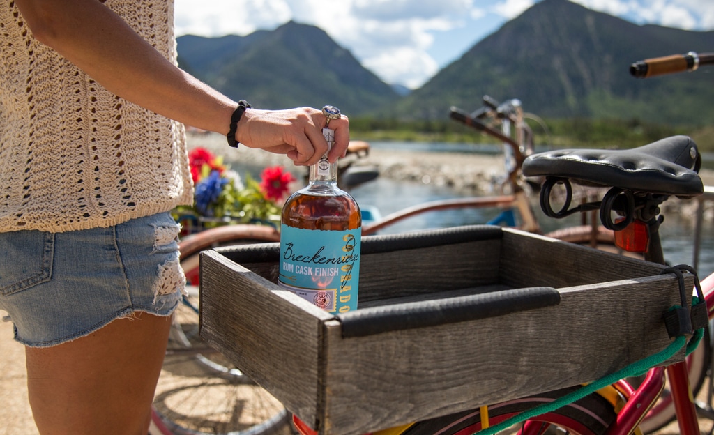 Breckenridge Rum Cask Finish bottle in bicycle basket