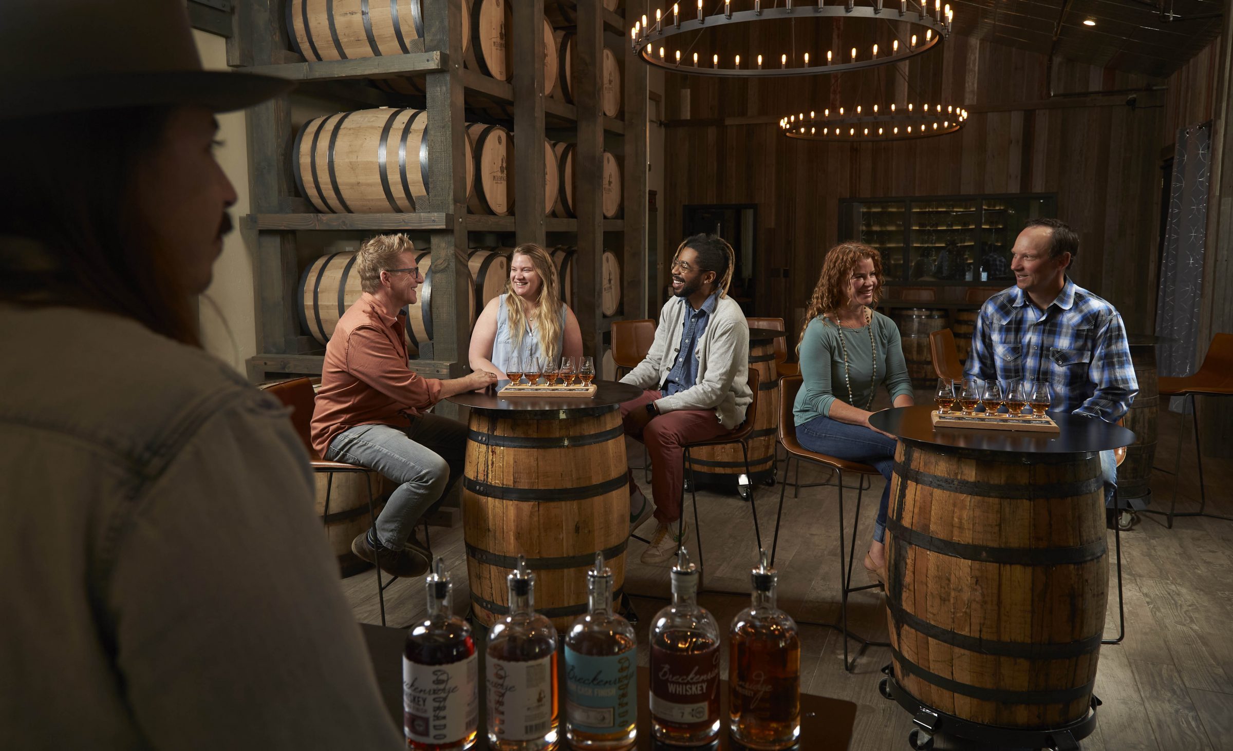 Friends tasting whiskey flights in tasting room